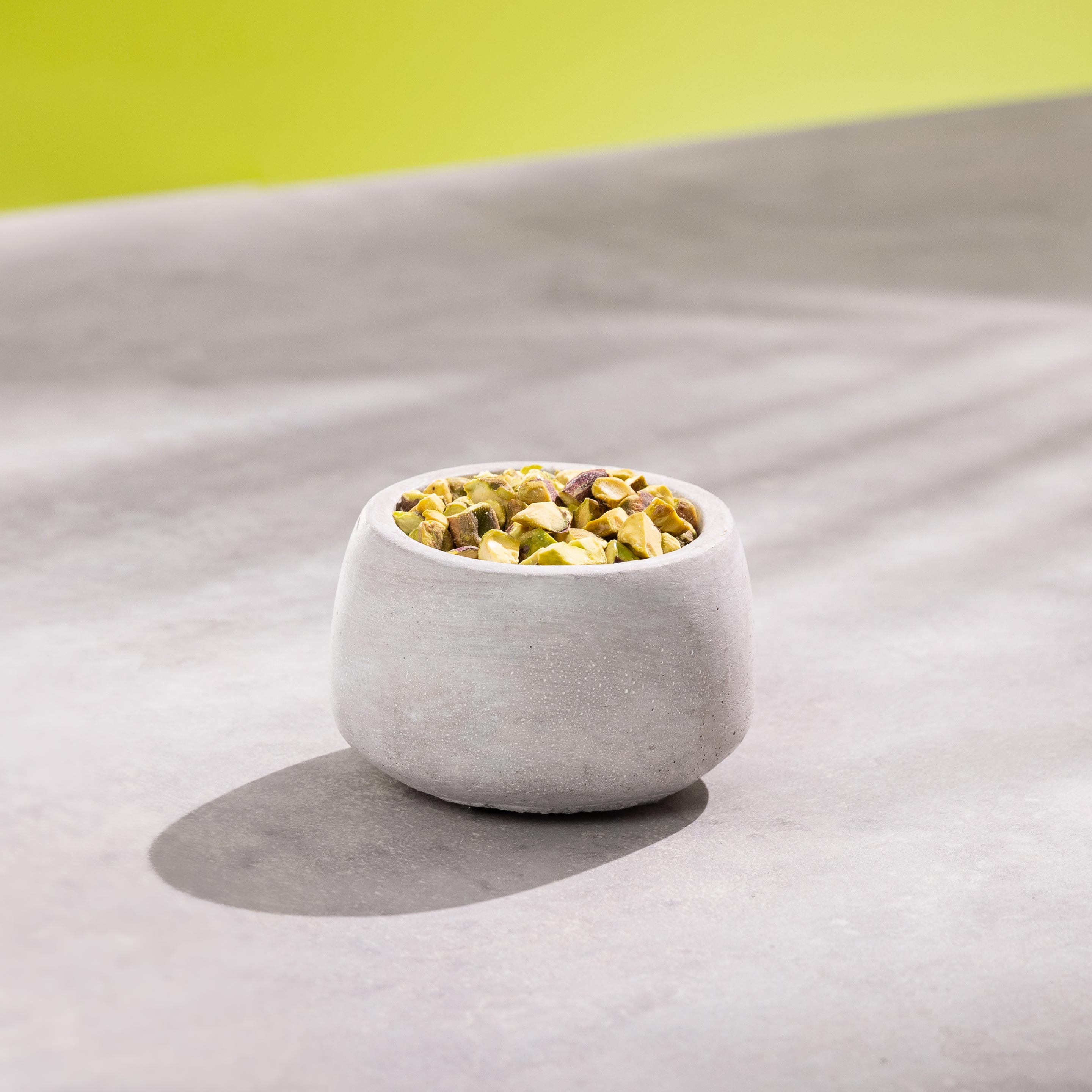 Pistachios in a bowl on counter