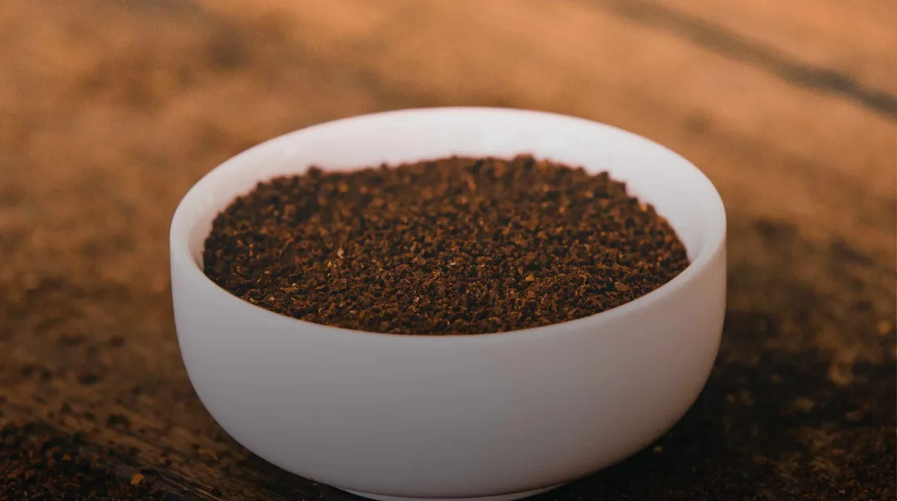 Ground coffee in bowl 