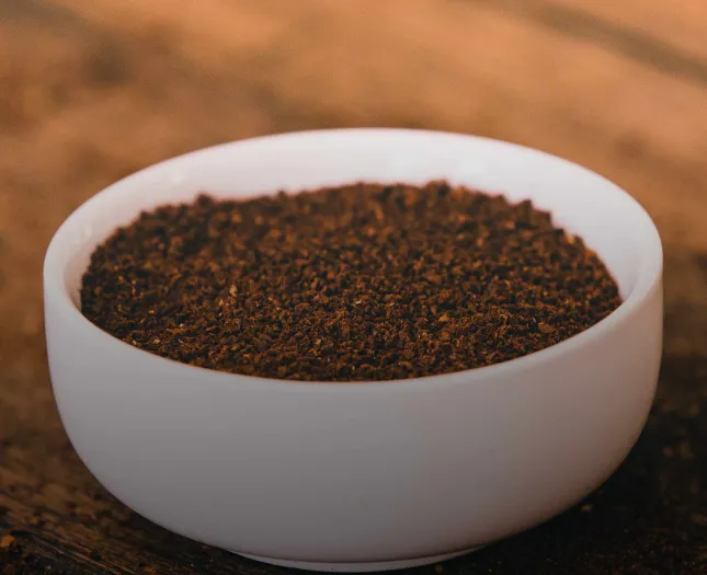 Ground coffee in bowl 